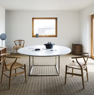 Fine Seagrass Herringbone carpet in dining room with 3 chairs and table.